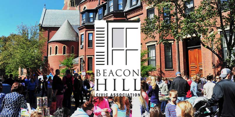 A large crowd of people outside with buildings in the background. The Beacon Hill Civic Association logo is centered.